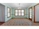 Traditional dining room features natural light from large windows and classic chandelier fixture at 195 Willow Way, Stockbridge, GA 30281