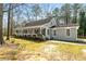 Charming single-story home with a welcoming front porch and mature trees at 195 Willow Way, Stockbridge, GA 30281