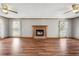 Spacious living room featuring a fireplace and two windows with natural light at 195 Willow Way, Stockbridge, GA 30281