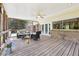 Spacious covered back porch with comfortable seating, ideal for entertaining at 3734 Fox Hills Se Dr, Marietta, GA 30067