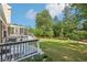 Expansive backyard with a deck, screened porch, and lush lawn at 3734 Fox Hills Se Dr, Marietta, GA 30067
