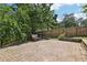 Cozy brick patio with a bench, perfect for outdoor seating and enjoying the serene backyard at 3734 Fox Hills Se Dr, Marietta, GA 30067