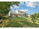 Expansive backyard with a deck and screened in porch offers space for outdoor relaxation and entertaining at 3734 Fox Hills Se Dr, Marietta, GA 30067