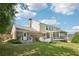 A full view of the home's backyard, featuring a deck, screened porch, and lawn at 3734 Fox Hills Se Dr, Marietta, GA 30067