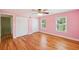 Bedroom with hardwood floors, windows and double door closet at 3734 Fox Hills Se Dr, Marietta, GA 30067