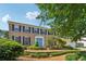 Traditional two-story brick home with blue shutters and a well-manicured front yard at 3734 Fox Hills Se Dr, Marietta, GA 30067