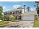 Traditional two-story brick home with attached two-car garage and well maintained yard at 3734 Fox Hills Se Dr, Marietta, GA 30067