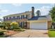 Charming brick home with a well-maintained lawn, mature trees, and an attached two-car garage at 3734 Fox Hills Se Dr, Marietta, GA 30067