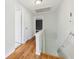 Bright hallway featuring hardwood floors and neutral paint at 3734 Fox Hills Se Dr, Marietta, GA 30067