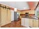 Kitchen features stainless appliances, an island and a barn-door pantry at 3734 Fox Hills Se Dr, Marietta, GA 30067