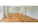 Open-concept living space with hardwood floors and white french doors at 3734 Fox Hills Se Dr, Marietta, GA 30067