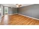 Bright living room featuring hardwood floors, ceiling fan, and neutral paint at 3734 Fox Hills Se Dr, Marietta, GA 30067