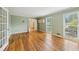 Spacious living room with hardwood floors and white french doors at 3734 Fox Hills Se Dr, Marietta, GA 30067
