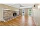 Living room featuring a brick fireplace, hardwood floors, and access to an outdoor deck at 3734 Fox Hills Se Dr, Marietta, GA 30067
