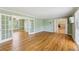 Bright living room with hardwood floors and white french doors leading to other rooms at 3734 Fox Hills Se Dr, Marietta, GA 30067