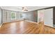 Spacious living room with hardwood floors, built-in shelves, and bright windows at 3734 Fox Hills Se Dr, Marietta, GA 30067