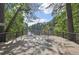Community wooden deck and lake overlook provides residents peaceful outdoor space with scenic water views at 3734 Fox Hills Se Dr, Marietta, GA 30067