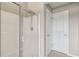 Modern bathroom showcasing a glass-enclosed shower and white walls at 1257 Park Pass Way, Suwanee, GA 30024