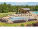This community offers an amazing pool, sundeck, and a covered patio with seating at 1257 Park Pass Way, Suwanee, GA 30024