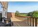 Enjoy outdoor living on this balcony with dark wicker chairs with views of pond at 1257 Park Pass Way, Suwanee, GA 30024