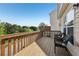Relax on this beautiful wood deck with dark wicker chairs and views of the nature area at 1257 Park Pass Way, Suwanee, GA 30024