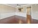 Open-concept dining area with hardwood floors, and modern trimwork at 1257 Park Pass Way, Suwanee, GA 30024