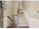 Entryway view featuring a stairway with carpet, wooden floors, and neutral paint at 1257 Park Pass Way, Suwanee, GA 30024