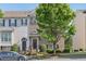 Charming two-story townhome featuring a brick facade, well-manicured landscaping, and a welcoming front entrance at 1257 Park Pass Way, Suwanee, GA 30024