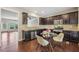 Charming eat-in kitchen with stainless steel appliances and granite countertops with seating for four at 1257 Park Pass Way, Suwanee, GA 30024