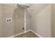 Laundry room with tiled floor and wire shelf at 1257 Park Pass Way, Suwanee, GA 30024