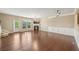 Spacious living room with hardwood floors, fireplace, large window, and crown molding at 1257 Park Pass Way, Suwanee, GA 30024