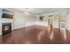 Spacious living room with hardwood floors, fireplace, and natural light at 1257 Park Pass Way, Suwanee, GA 30024