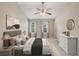 This main bedroom features a ceiling fan, and abundant natural light from the two windows at 1257 Park Pass Way, Suwanee, GA 30024