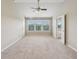 Bright main bedroom with vaulted ceilings, ensuite access, and many windows at 1257 Park Pass Way, Suwanee, GA 30024