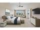 Bright main bedroom with vaulted ceilings, ensuite access, and many windows at 1257 Park Pass Way, Suwanee, GA 30024
