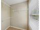 A walk-in closet with vinyl flooring and wire shelving and a window at 1257 Park Pass Way, Suwanee, GA 30024