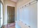 Welcoming entryway with custom bench and coat hooks, creating an organized and inviting space when you arrive at 255 Nicklaus Cir, Social Circle, GA 30025