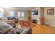 Comfortable living area with plush seating and a mounted television at 255 Nicklaus Cir, Social Circle, GA 30025