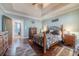 Spacious main bedroom with trey ceilings, hardwood floors, and easy access to laundry room at 255 Nicklaus Cir, Social Circle, GA 30025