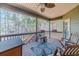 Spacious outdoor patio featuring wood floors, open views and rocking chairs; perfect for entertaining or relaxing at 255 Nicklaus Cir, Social Circle, GA 30025