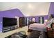 Spacious primary bedroom with a vaulted ceiling, complemented by dark furniture and accents for a relaxing retreat at 3740 Arminto Dr, Ellenwood, GA 30294