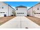 Rear exterior view of a two-story home with a two-car garage and driveway at 4658 Electric Sw Ave, Mableton, GA 30126