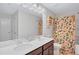 Bathroom featuring double sinks, modern fixtures, and a vibrant shower curtain at 4658 Electric Sw Ave, Mableton, GA 30126