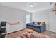 Bright bedroom with a daybed, dresser, and chair offers a cozy and functional space at 4658 Electric Sw Ave, Mableton, GA 30126