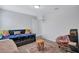 Bright bedroom features comfortable daybed with decorative pillows, chair, and cozy rug at 4658 Electric Sw Ave, Mableton, GA 30126