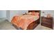 Bedroom featuring cozy bed with drawers, a nightstand, and soft lighting at 4658 Electric Sw Ave, Mableton, GA 30126