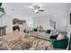Open-concept living room with hardwood floors, stylish furniture, and a view of the kitchen at 4658 Electric Sw Ave, Mableton, GA 30126