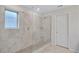 Modern shower with glass enclosure, tiled walls, and built-in shelving at 4658 Electric Sw Ave, Mableton, GA 30126