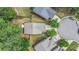 An aerial view of a house with a well-maintained yard and a driveway leading to a cul-de-sac at 6155 Falls Landing Dr, Cumming, GA 30040
