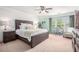 Charming primary bedroom featuring calming colors, plush carpet, and natural lighting at 6155 Falls Landing Dr, Cumming, GA 30040